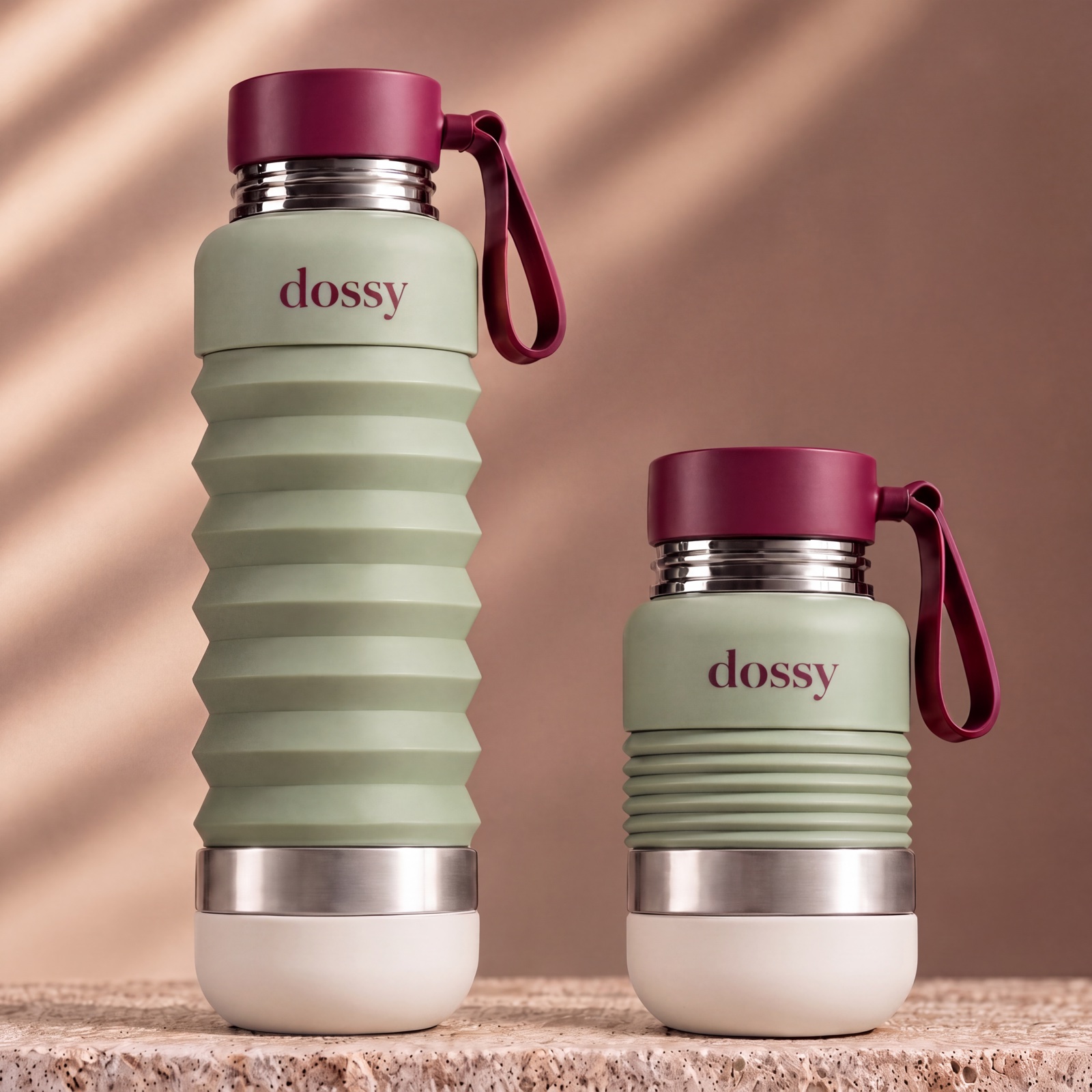 Two sage dossy bottles side by side: one at full height, one folded down small